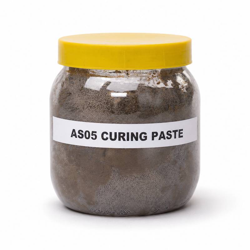 tandoor-curing-paste-AS05-jar-front-label Tandoor oven Curing Paste AS05 – front view of clear plastic jar with yellow lid filled with dark grey-brown curing paste, showing white label reading AS05 CURING PASTE, on white background